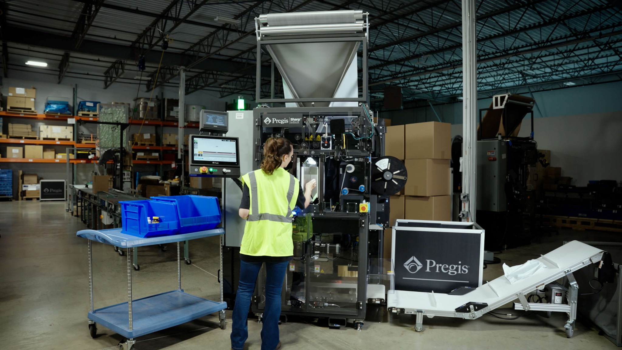 Operator packing an order on the Pregis Sharp InfinX rightsized mailing system